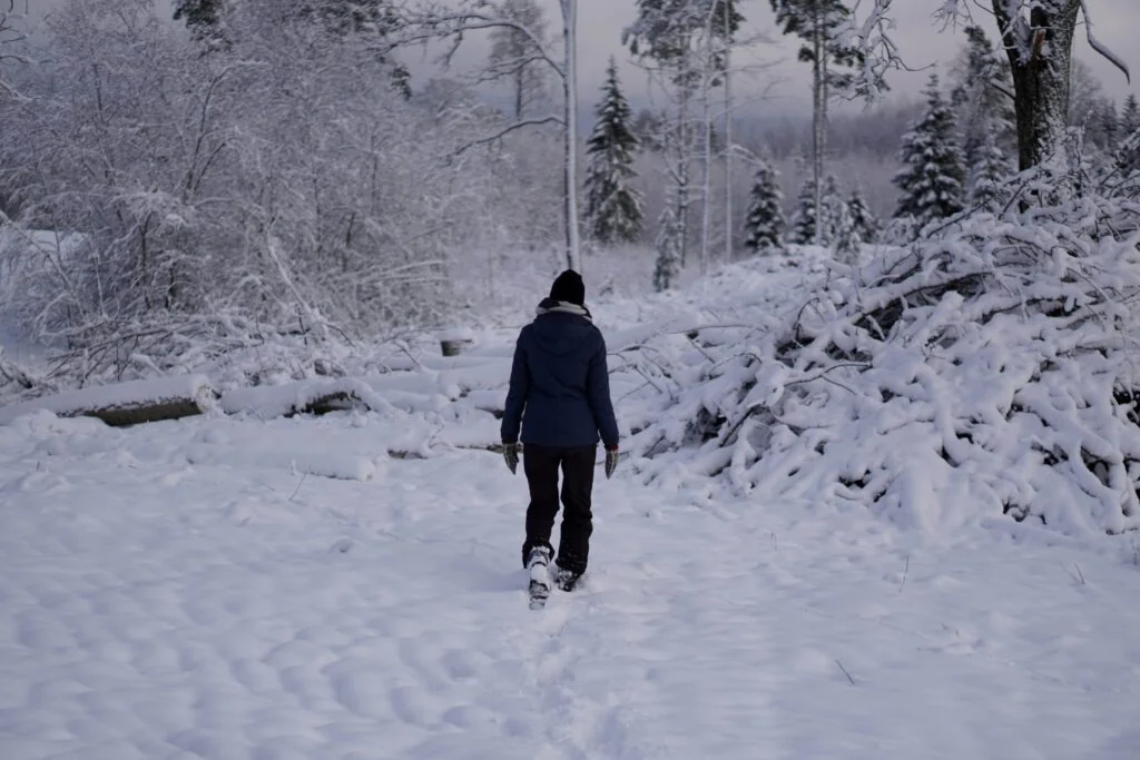 girl in snow in latvia
