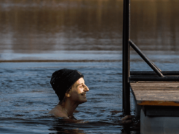 girl enjoys cold water dipping in latvia