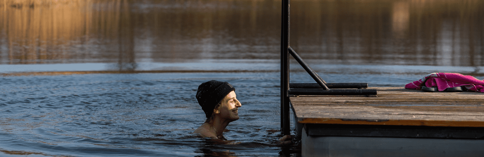 girl enjoys cold water dipping in latvia