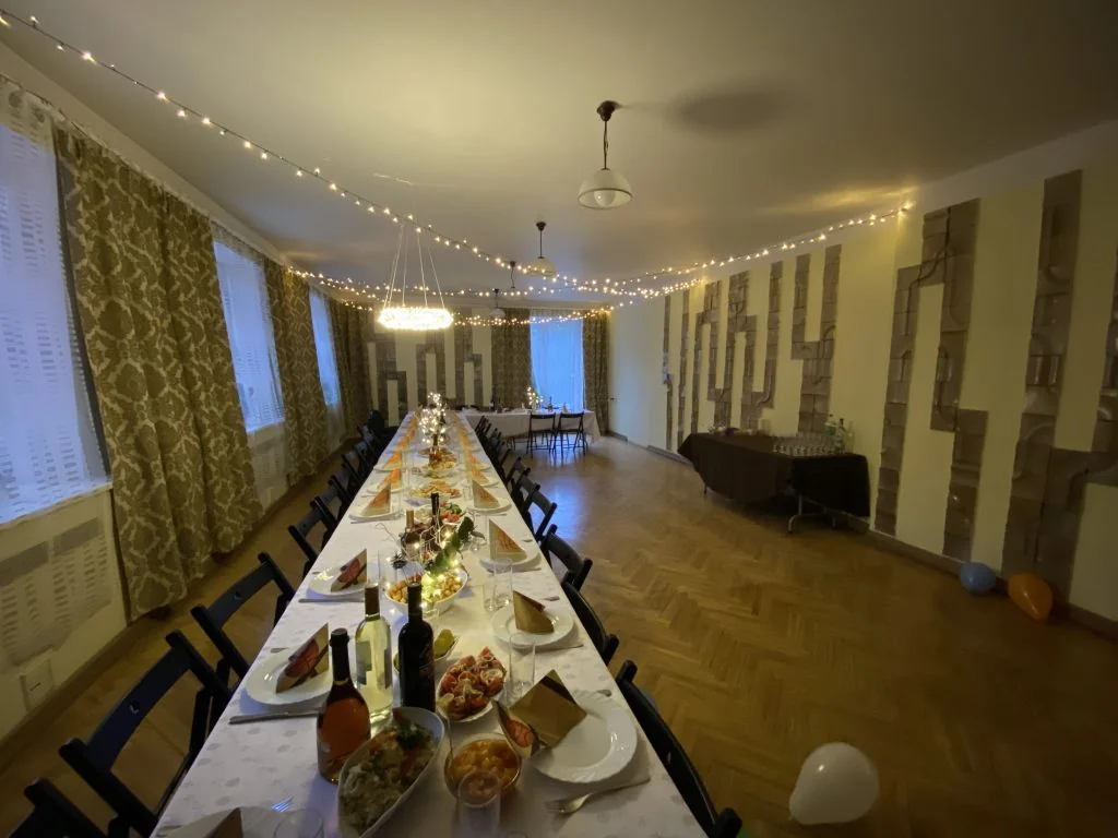 a function room or banketu zale in latvia with a table full of food