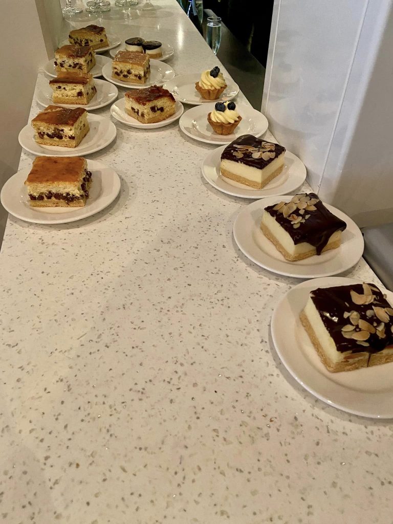 Pieces of cake lined up on the bar at a theatre in Latvia