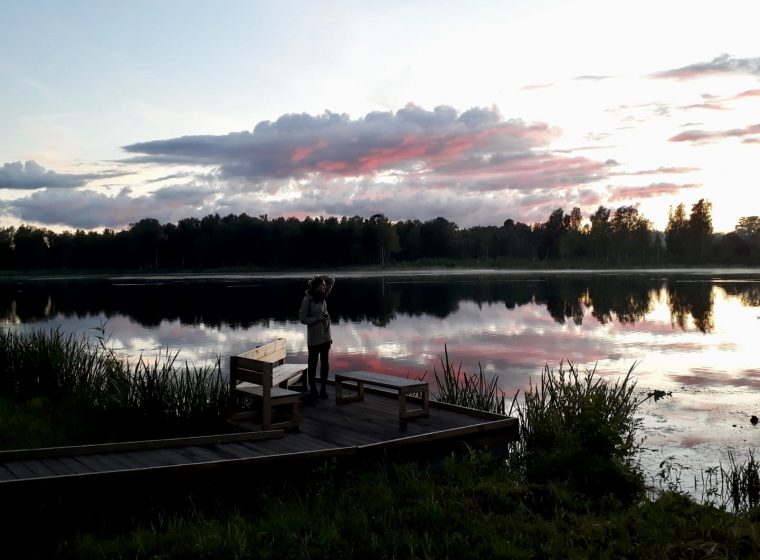 Clothes Shopping In Riga Updated In 2023 Life In Riga   Woman Stands Beside Lake In Latvia 760x560 