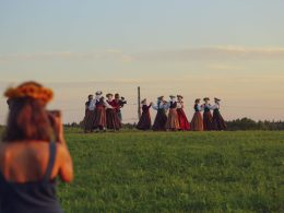 filming a Latvian summer solstice celebration in a field