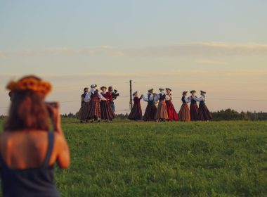 filming a Latvian summer solstice celebration in a field