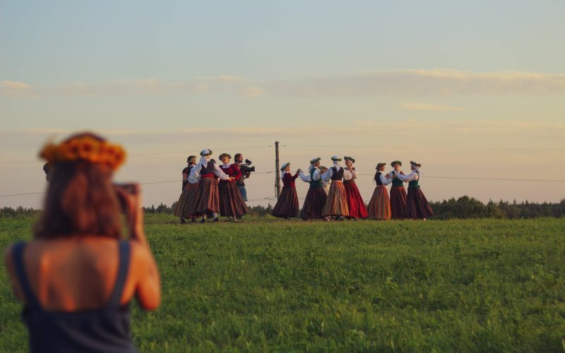 filming a Latvian summer solstice celebration in a field